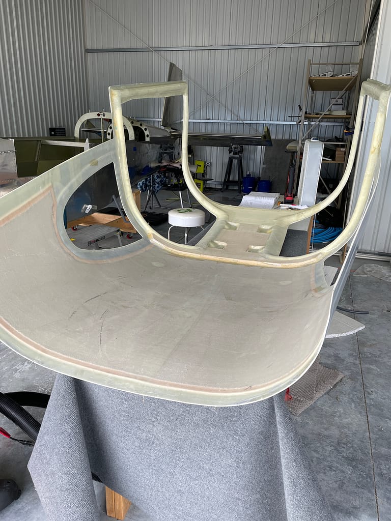This is the RV-10 fiberglass cabin top laid upside down on a padded workbench.