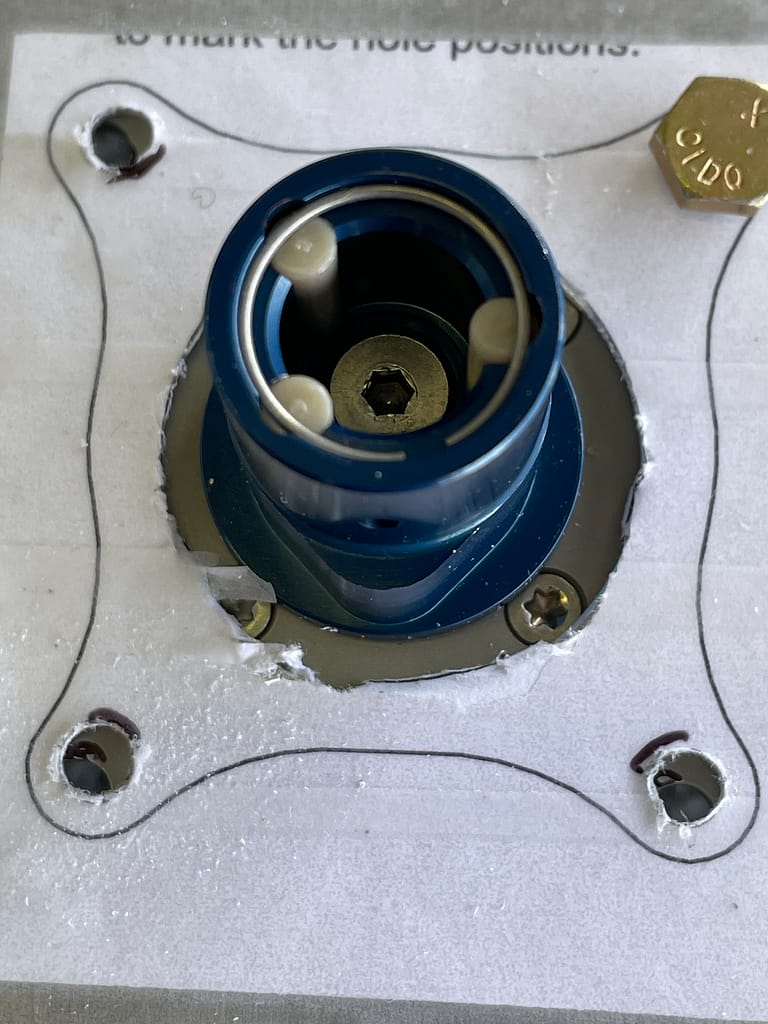 view of fuel selector protruding through a template
