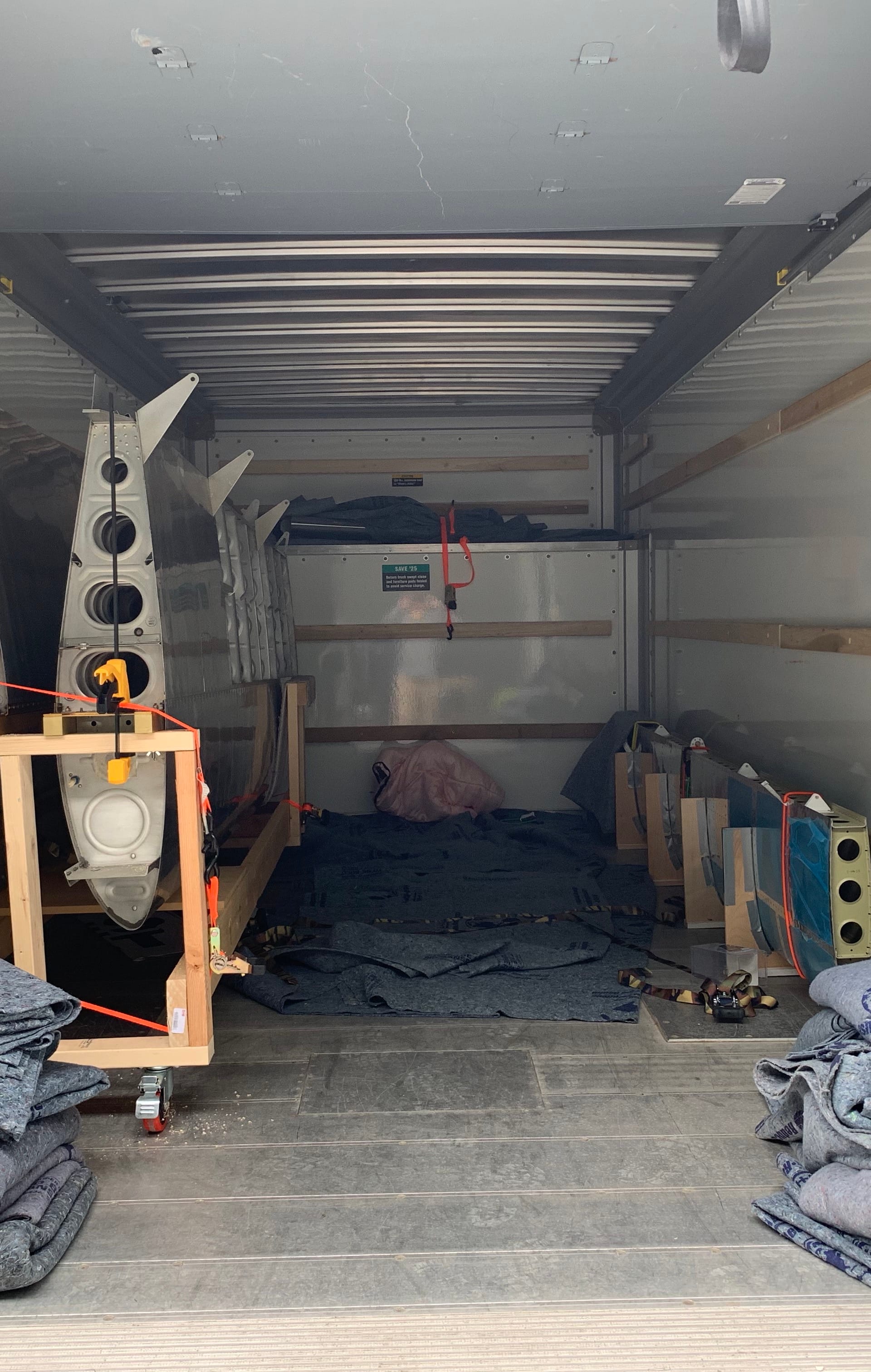 Moving van packed with airplane parts